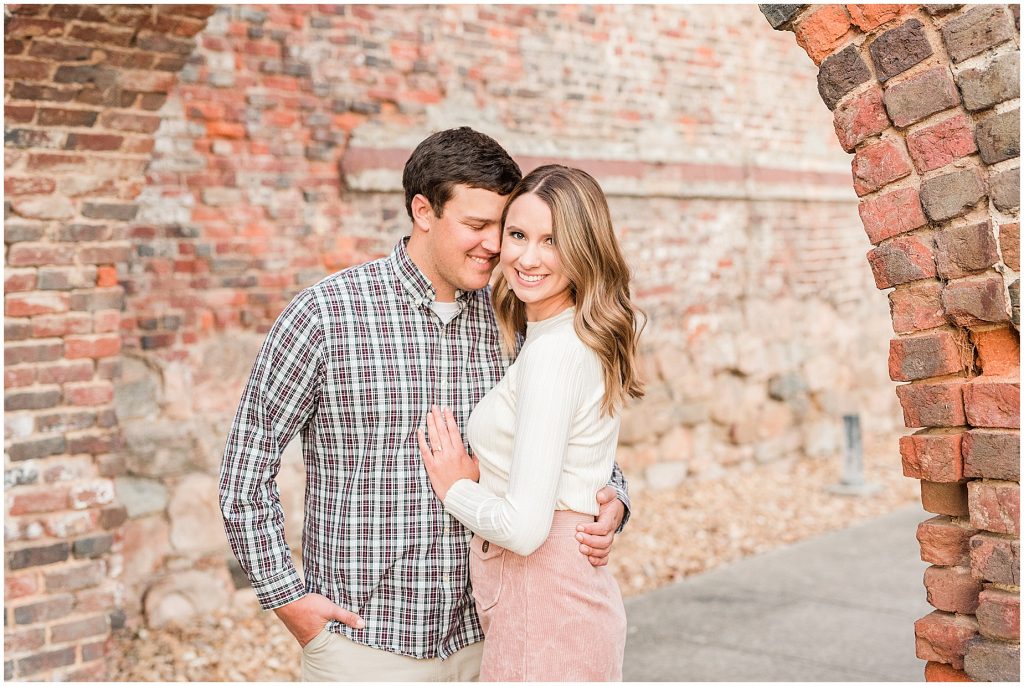 engagement session couple at tredegar ironworks brick arch in richmond virginia questions to ask