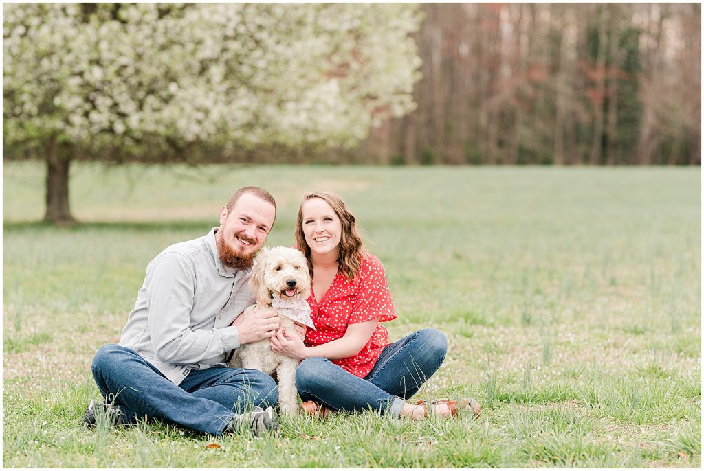 Richmond Spring Engagement Session sitting with dog at Wisteria Farms