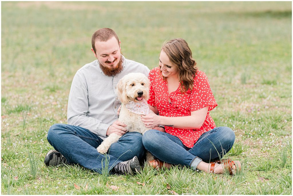 Richmond Spring Engagement Session sitting with dog at Wisteria Farms