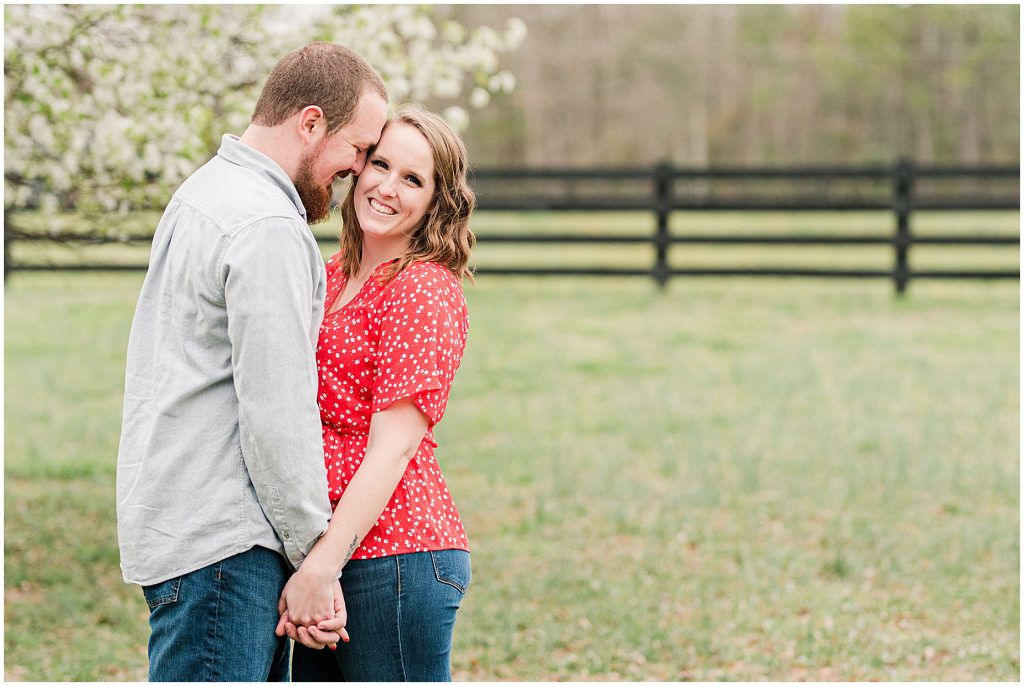 Richmond Spring Engagement Session sitting at Wisteria Farms with field