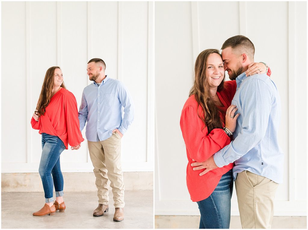 engagement session couple at edgewood barn at overhang with white wall behind