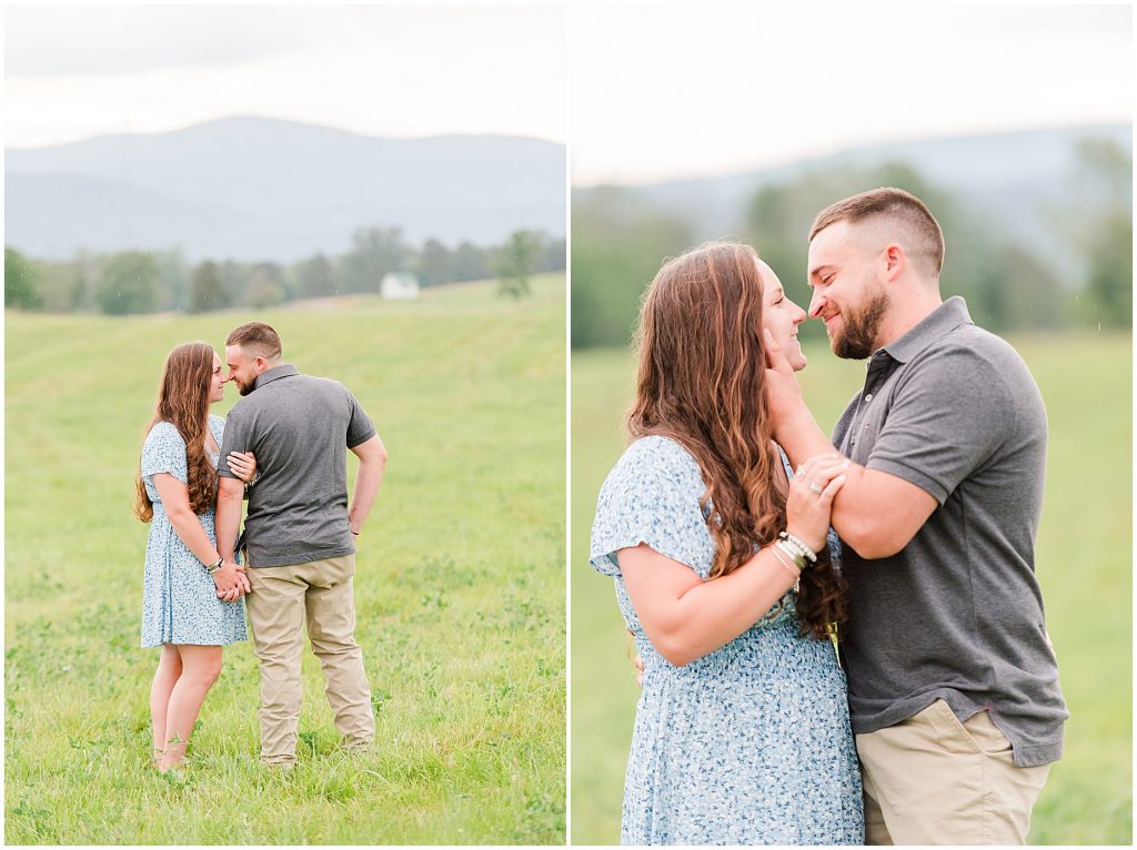 engagement session couple in blue and grey standing in field at edgewood barn venue with shenandoah mountain view