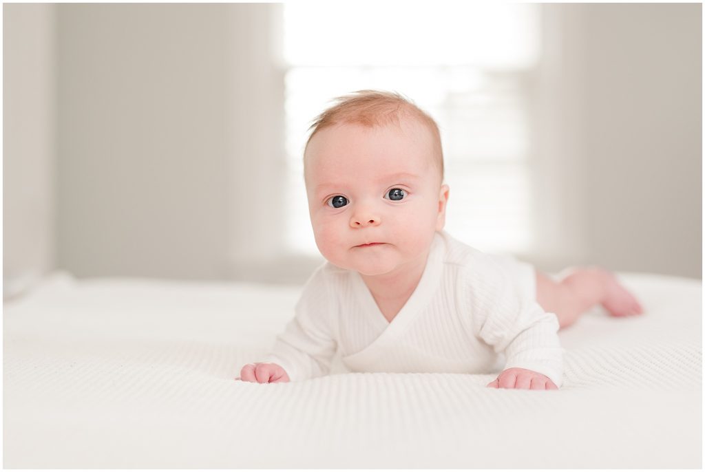 Richmond photographers niles lying on bed at 3 months