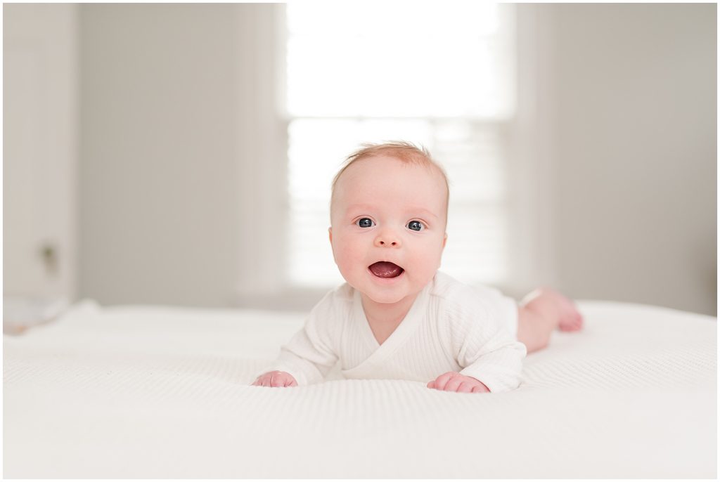 Richmond photographers niles lying on bed at 3 months