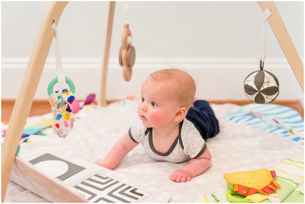 Richmond photographers niles lying on stomach with play mat