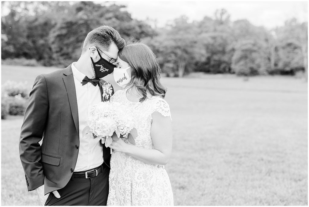 coronavirus mini wedding bride and groom with just married masks