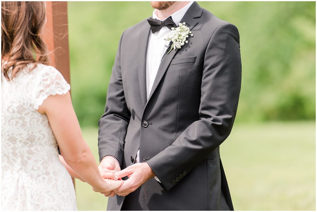 barn at edgewood coronavirus mini wedding bride and groom holding hands