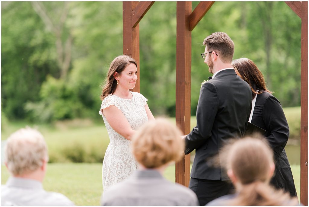 barn at edgewood summer mini wedding bride and groom at aisle holding hands