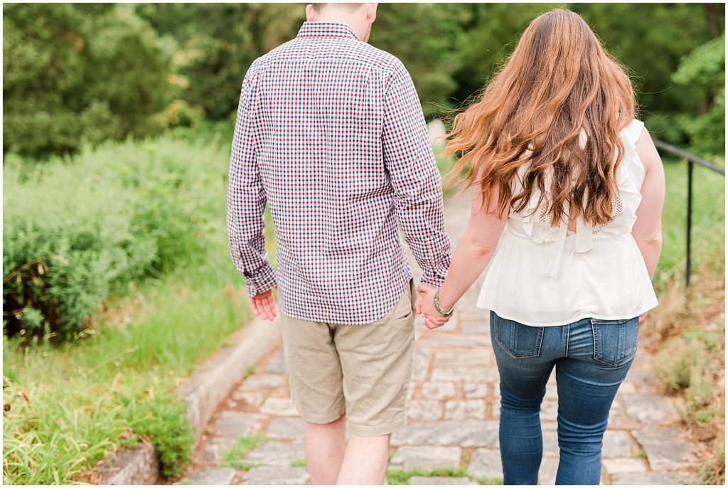 maymont park engagement session walking on stone path to flower garden