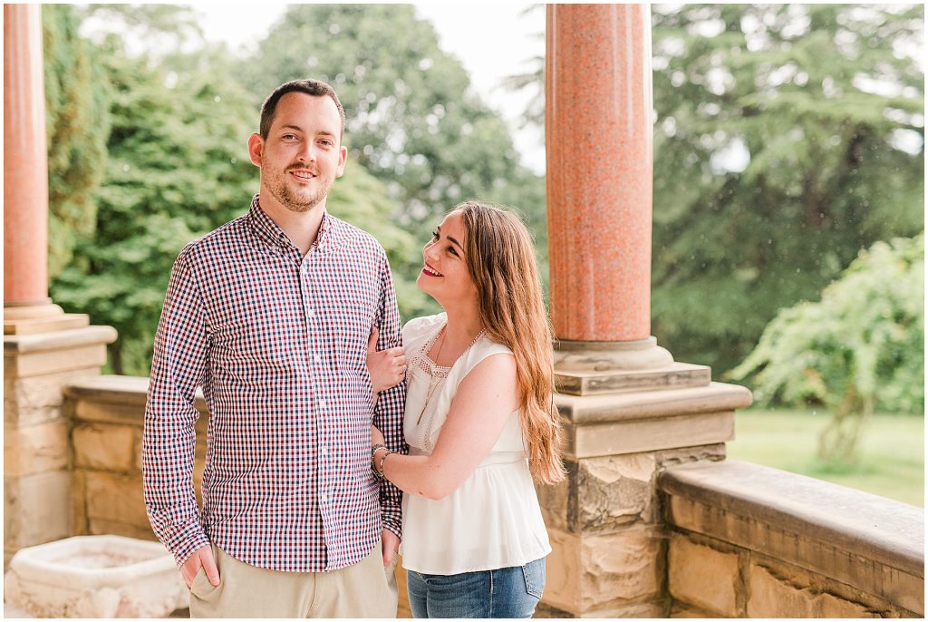 maymont park engagement couple on mansion porch while it rains