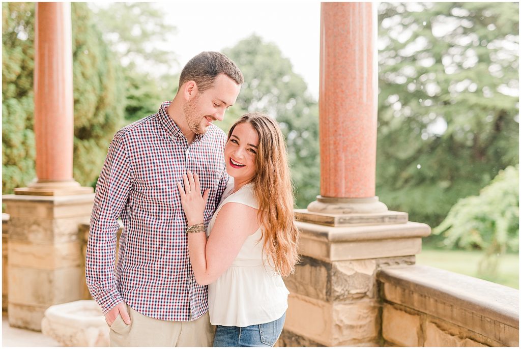 maymont park engagement couple on mansion porch while it rains