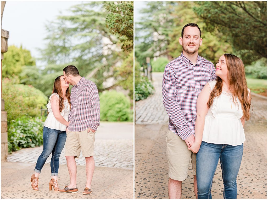 maymont park engagement couple sharing a kiss under arch at mansion