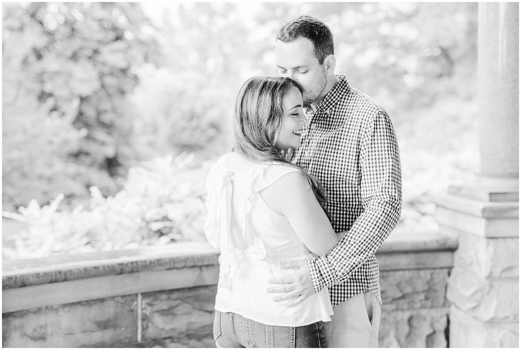 maymont park engagement couple hugging on porch of mansion