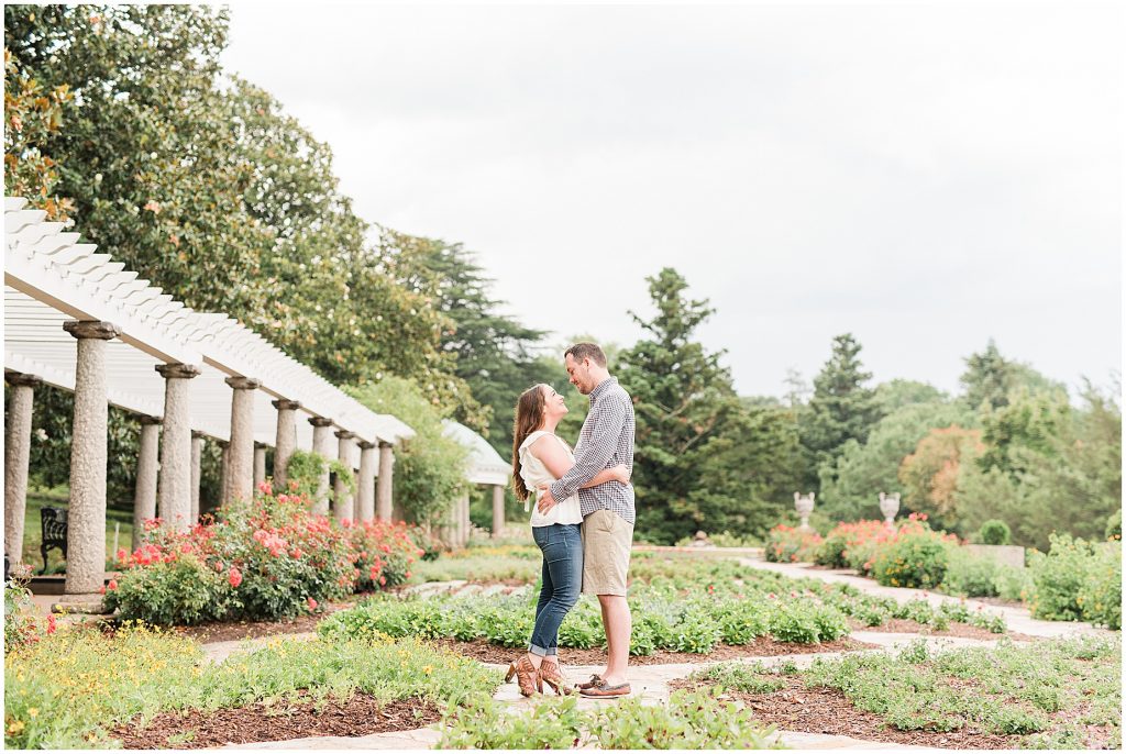 engagement session couple at maymont park standing in italian flower garden
