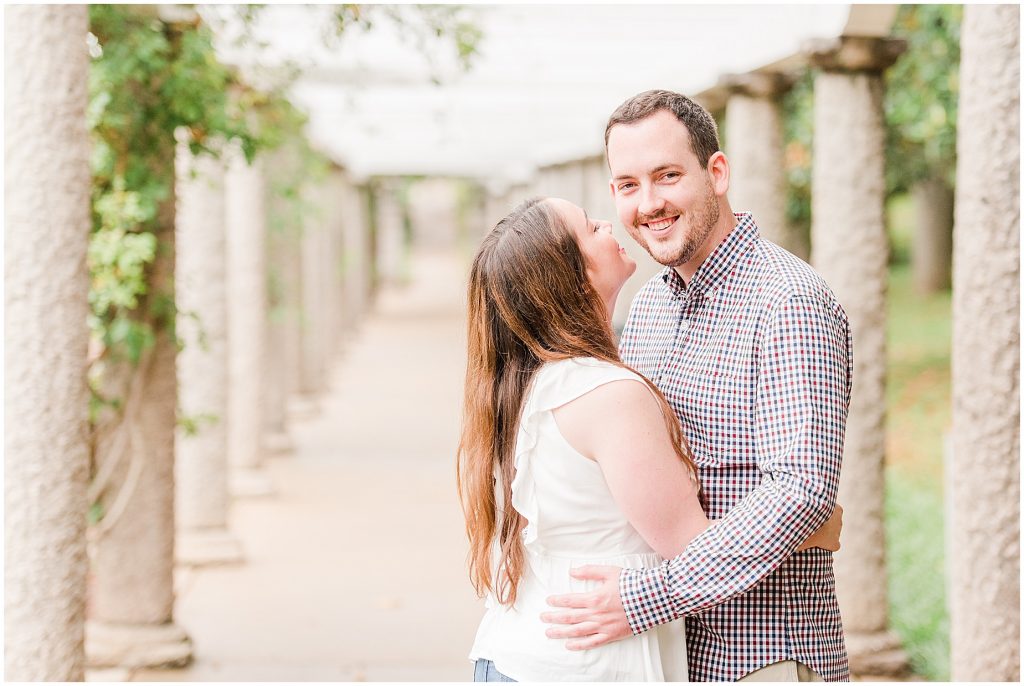 engagement session couple at maymont park standing under gazebo next to italian flower garden