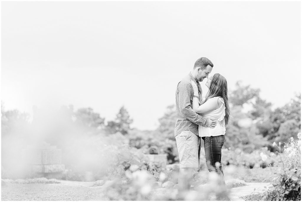 engagement session couple at maymont park standing in italian flower garden in black and white