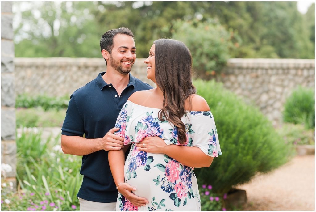 maymont park maternity husband and wife laughing in garden in Richmond Virginia