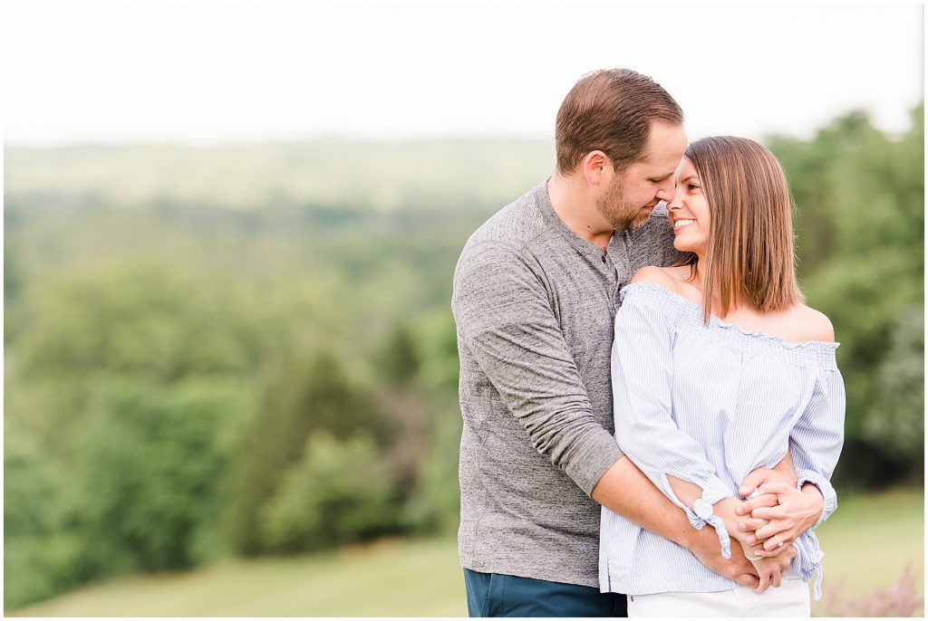 Lansdowne golf resort engagement couple in blue and grey outfits at golf course