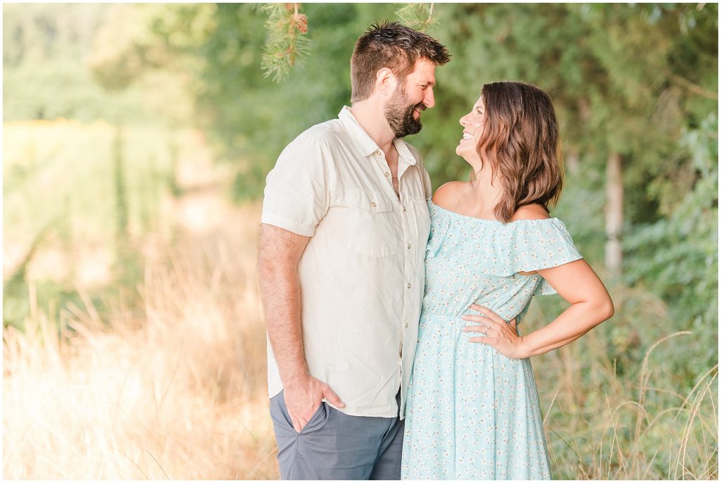 engaged couple in tall grass, richmond virginia
