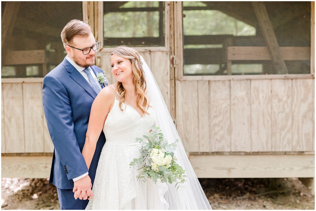 bride & groom at cabin chanco on the james river richmond virginia wedding photographers