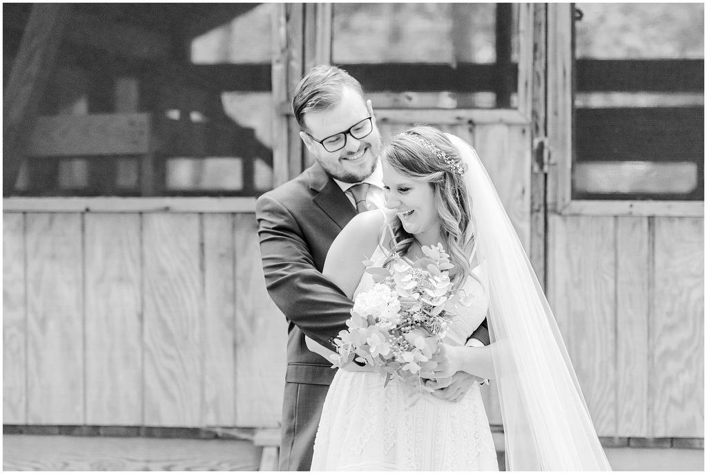 bride & groom at cabin chanco on the james river richmond virginia wedding photographers