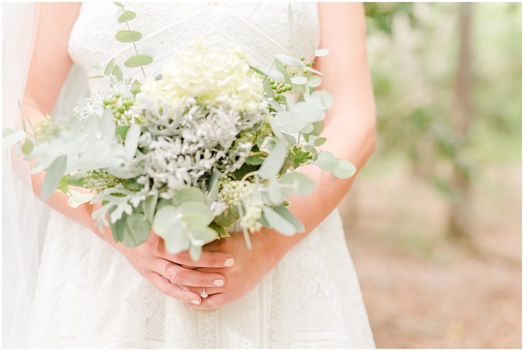 bride in woods with floral bouquet chanco on the james river richmond virginia wedding photographers