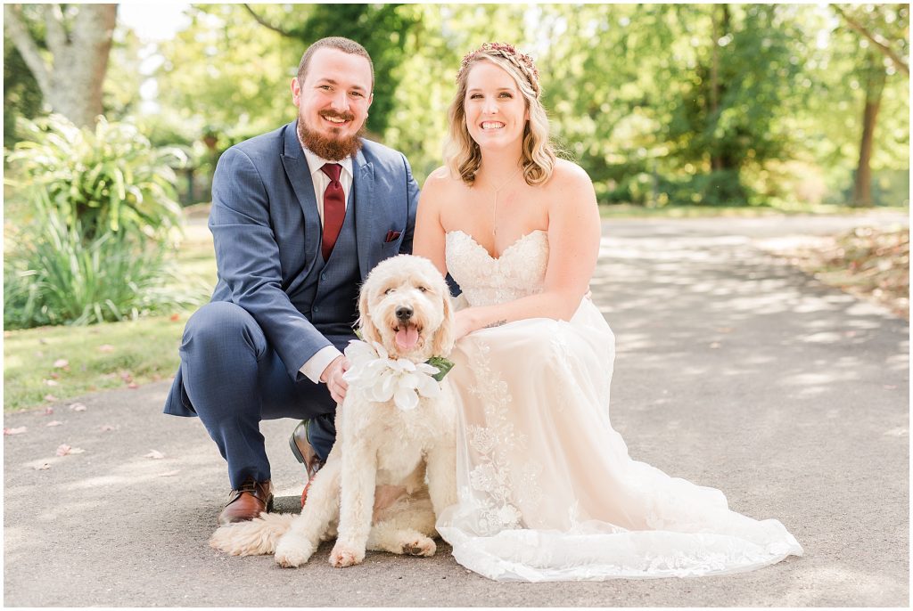 bride and groom with golden doodle dog at wedding richmond