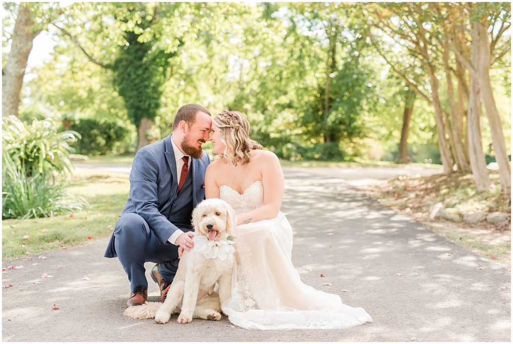 bride and groom with golden doodle dog at wedding richmond