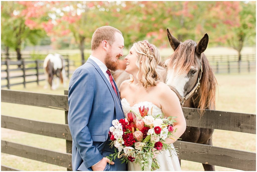 bride and groom with horses at wisteria farms richmond virginia