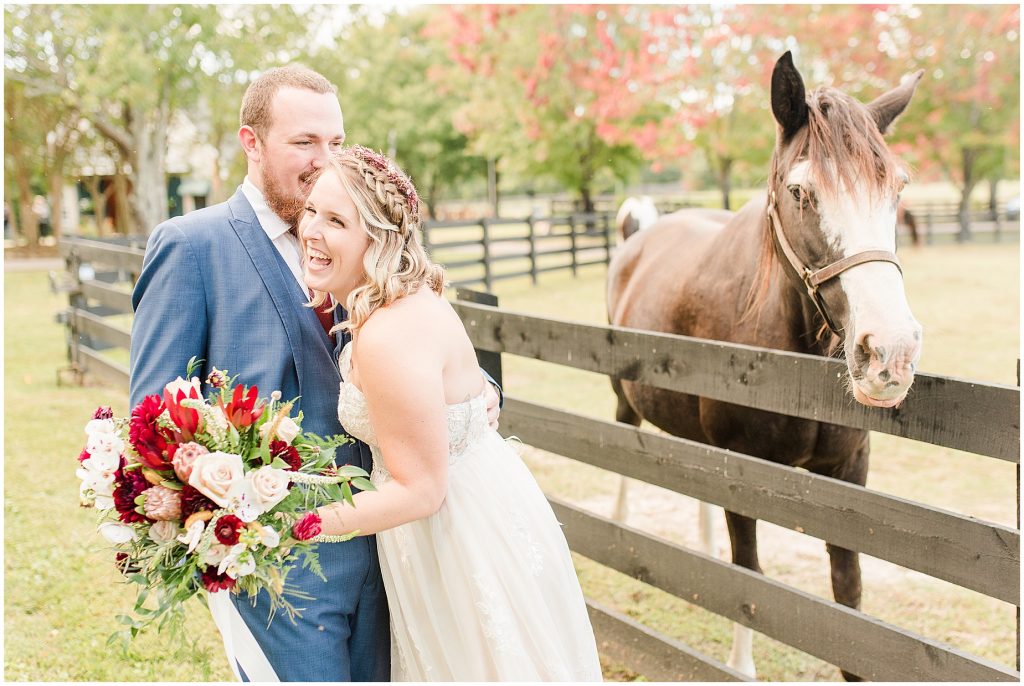 bride and groom with horses at wisteria farms richmond virginia
