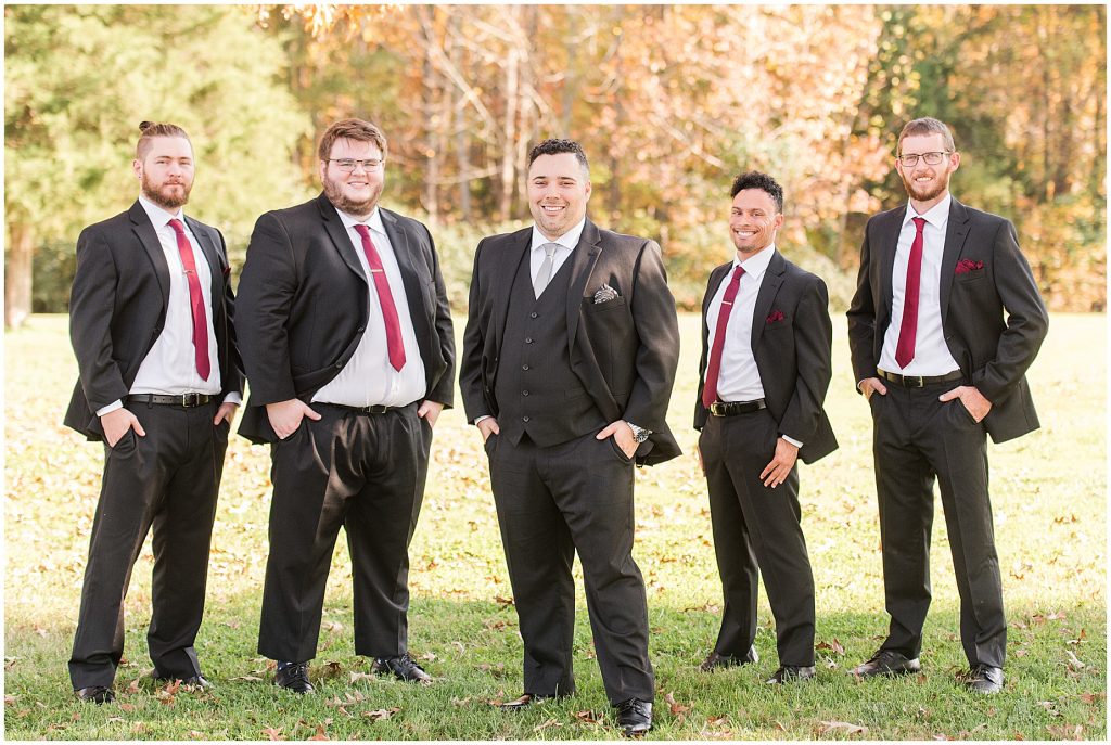 groom and groomsment outdoor fall portraits at amber grove virginia wedding venue