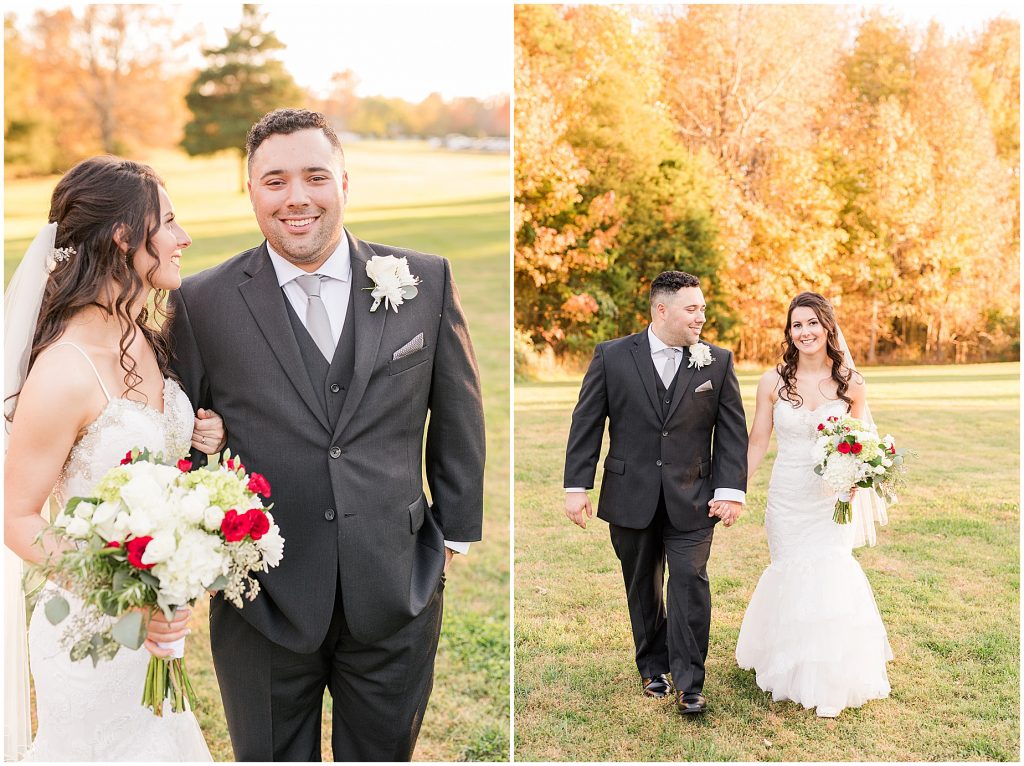 bride and groom walking in field with fall trees behind at amber grove in richmond