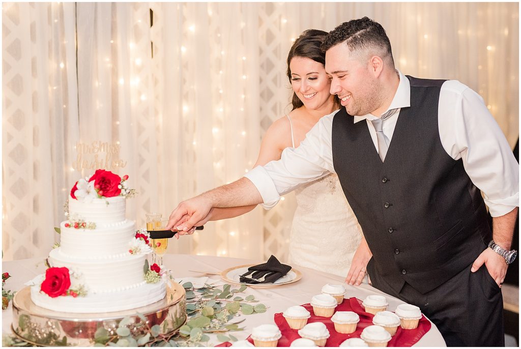 amber grove wedding reception bride and groom cutting cake richmond virginia
