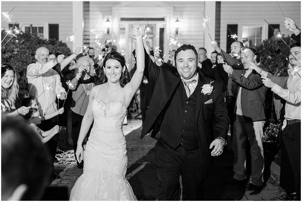 bride and groom sparkler exit leaving amber grove wedding