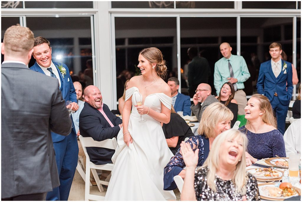 bride and groom laughing with champagne in hands at Waverly Estate reception