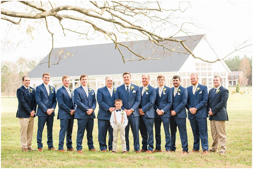 groom and groomsmen in blue suits with ring bearer and usthers at waverly estate in southern virginia
