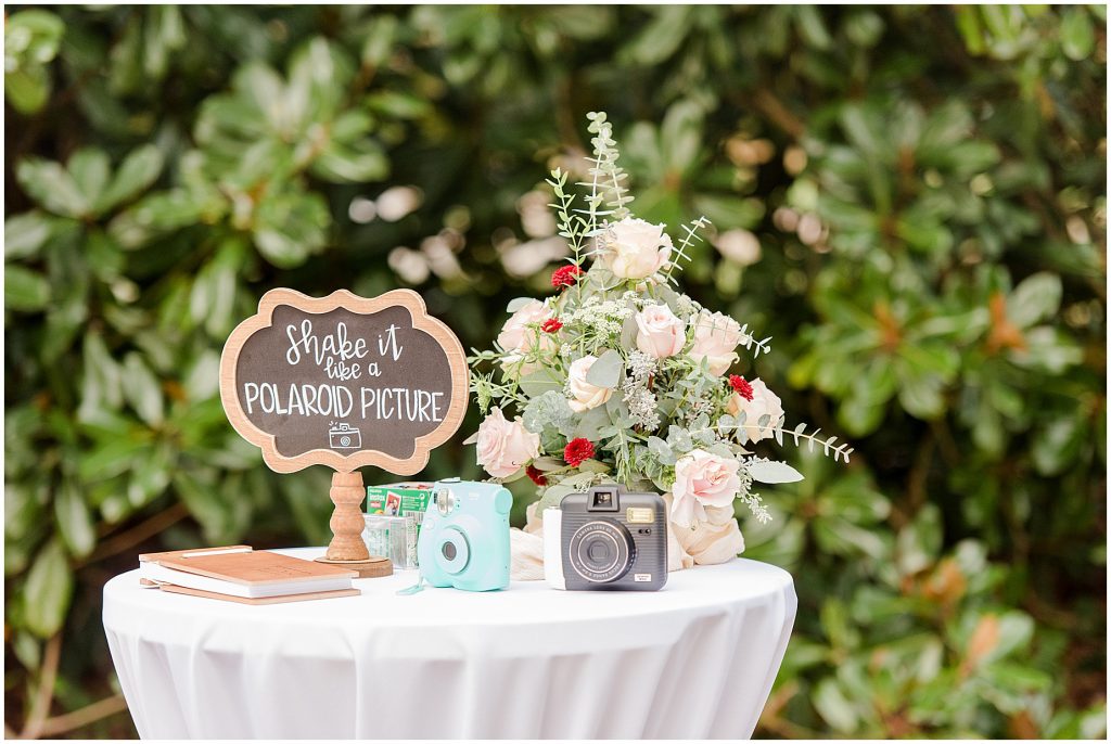 wedding reception cocktail hour guestbook with polaroid cameras at Waverly Estate in southern Virginia