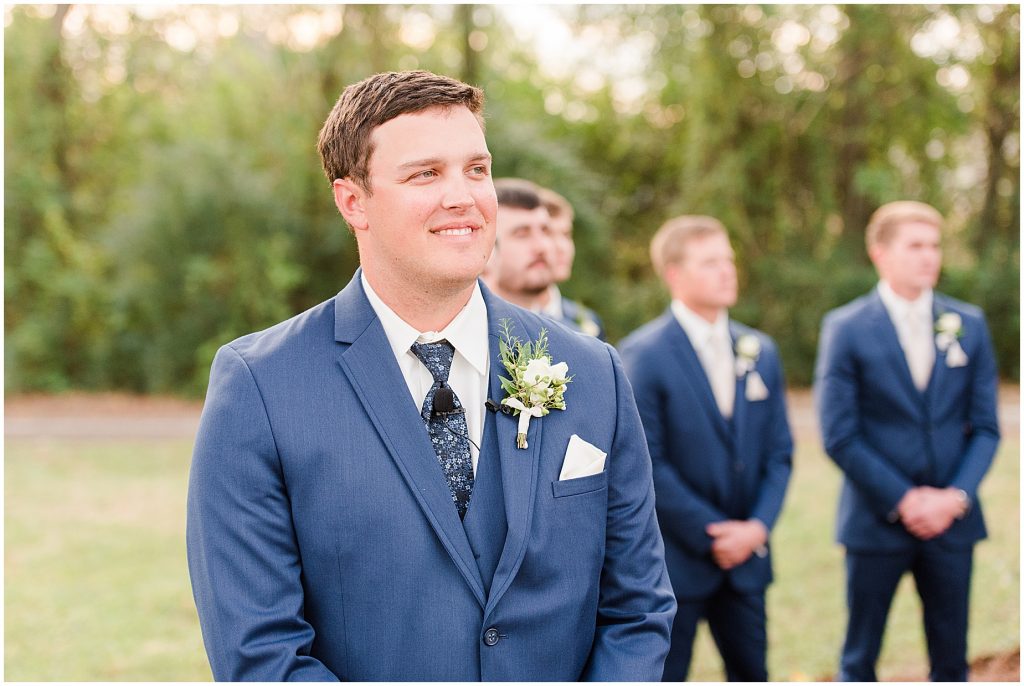 grooms reaction at ceremony as he sees his bride for the first time