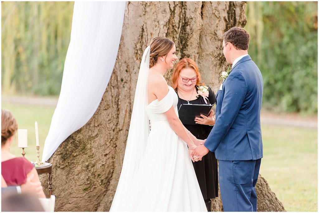 bride and groom saying vows at ceremony