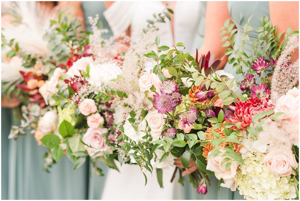 bride and bridesmaids multicolored wild flowers