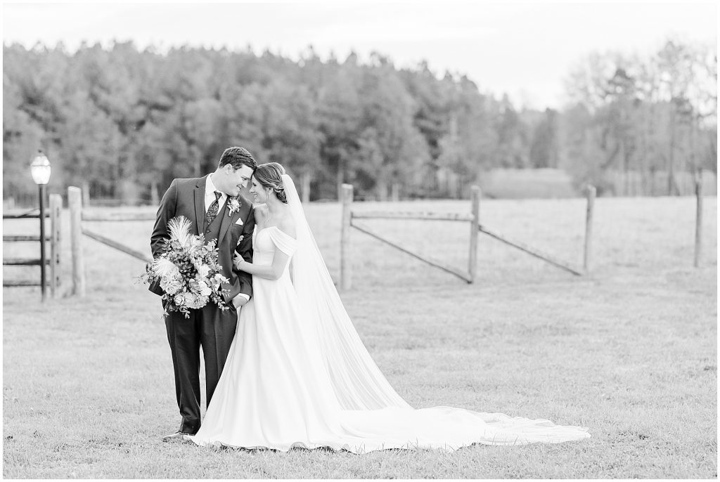 bride and groom in field at Waverly Estate in southern Virginia