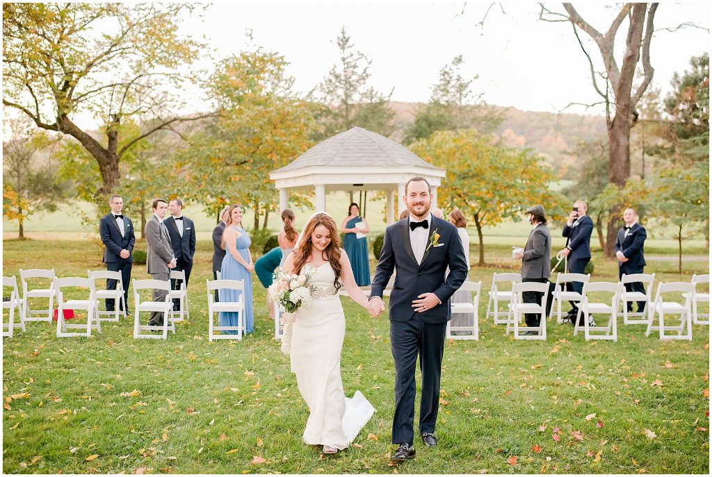 bride and groom exiting mini wedding ceremony outside at whitehall estate in bluemont virginia