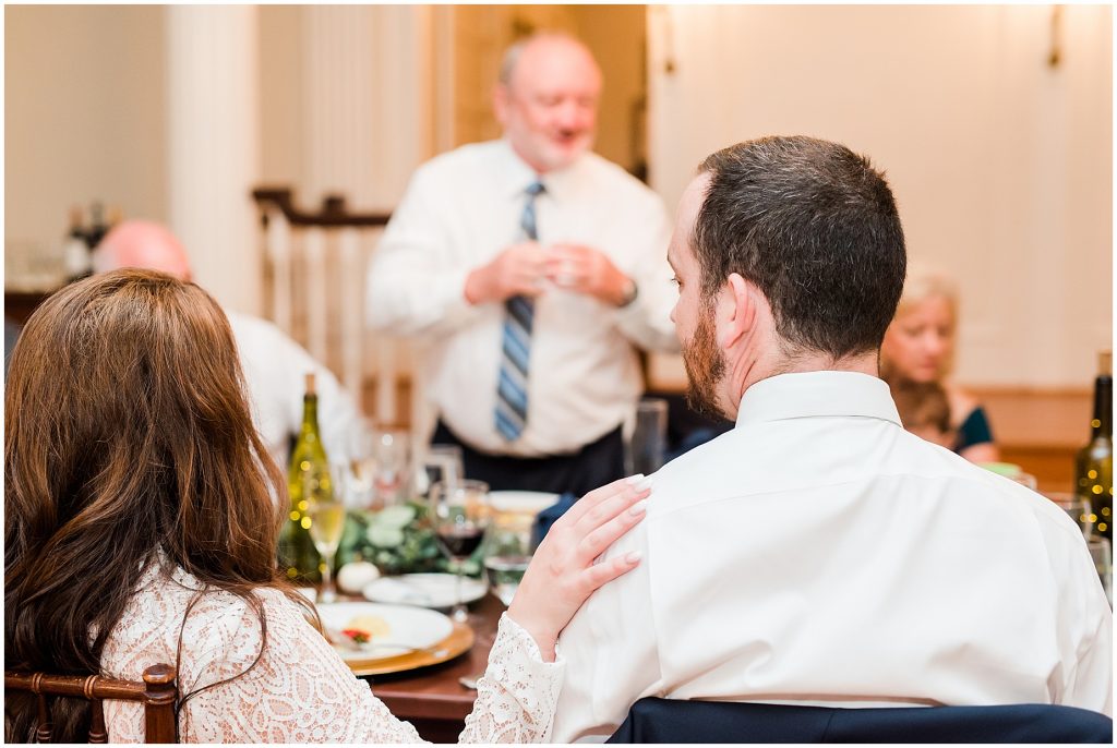 toasts for bride and groom at reception inside whitehall estate for mini wedding dinner