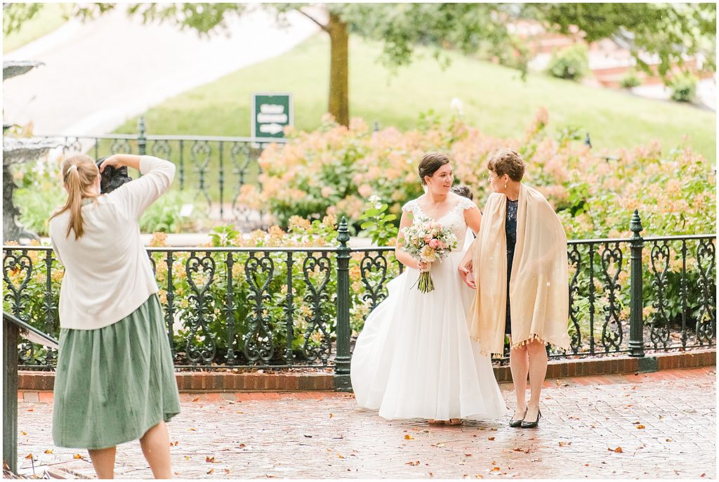 Virginia Photographers Behind the Scenes taking portraits of bride during the ceremony at the virginia Capitol Building in richmond
