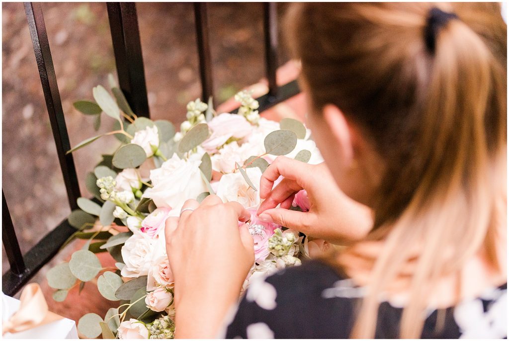 photographer taking ring details on bouquet in Richmond Va