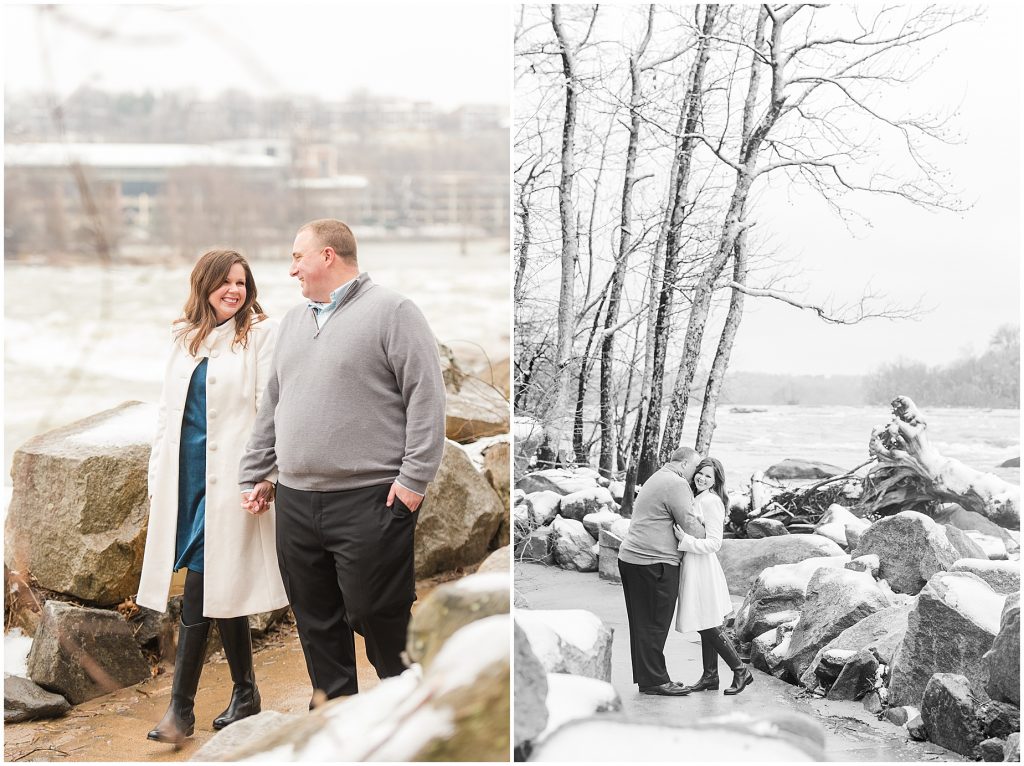 couple walking on belle isle in downtown richmond virginia for engagement session during the snow