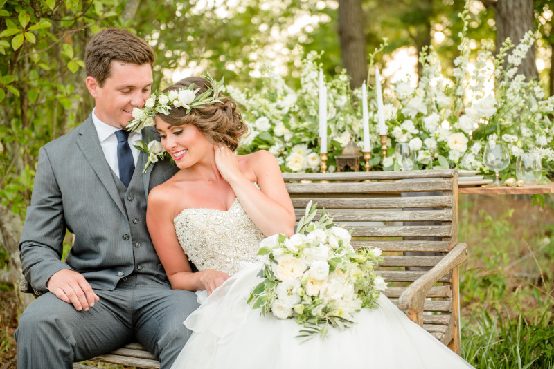 bride and groom on bench