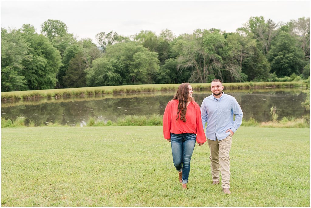 engagement sessions with couple at edgewood barn in front of lake